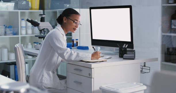 Shot of a young scientist using a computer while conducting medical research in a laboratory