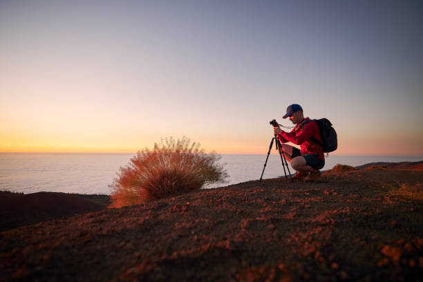 istock Hobby photographer waiting for beautiful sunset 1327109998
