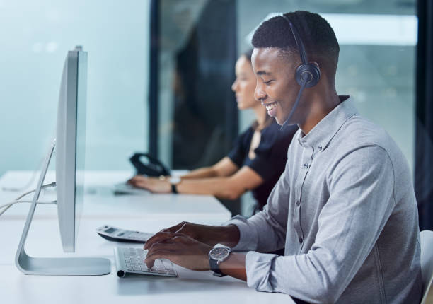 istock Shot of a young call centre agent typing in an office 1327110925