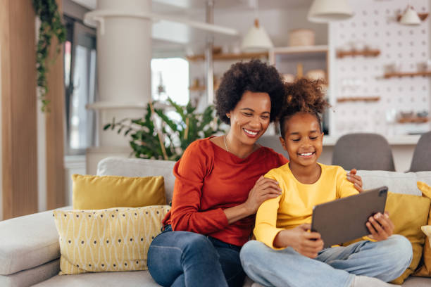 istock Adult woman, learning from her daughter about technology. 1327111064