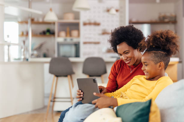 istock Young girl, taking advice from her mother. 1327111068