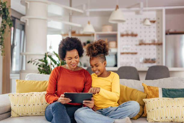 istock Mother and daughter, making plans for the summer. 1327111070