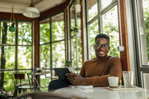 istock Adult man, being happy with his work, while sitting in the bar. 1327112185