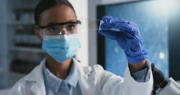 Photo of Shot of a scientist conducting medical research in a laboratory