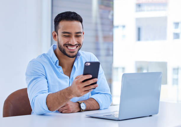 istock Shot of a businessman using his smartphone to send a text at work 1327113513