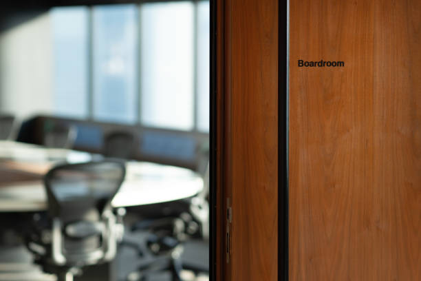 Generic view of a standard boardroom from the entrance Generic view of a standard boardroom from the entrance shareholders meeting stock pictures, royalty-free photos & images