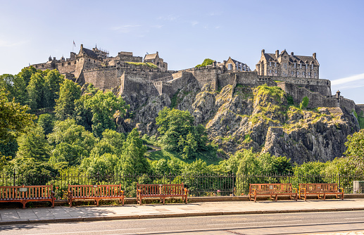 Edinburgh, Scotland - A summer view of Edinburgh Castle as seen from Princes Street, with the southern pavement of Princes Street in the foreground.