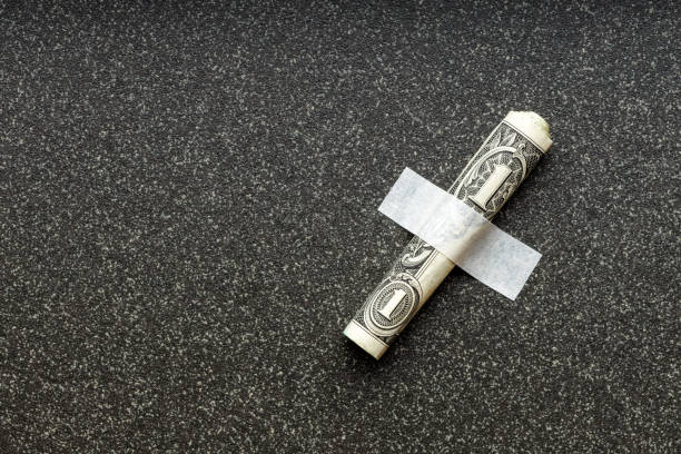 istock the dollar is rolled up and fixed against the porcelain stoneware 1327117326
