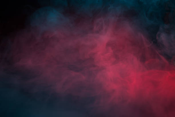 istock Colorful smoke on a black background closeup 1327119235