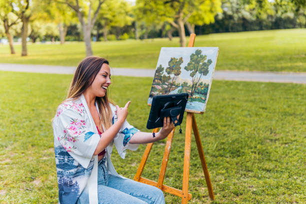 istock Artist making a video call to show her work 1327119853