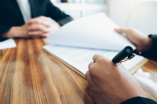 Business people negotiating a contract. Close up of business partners sign contract at meeting. Business people negotiating a contract. witness stock pictures, royalty-free photos & images