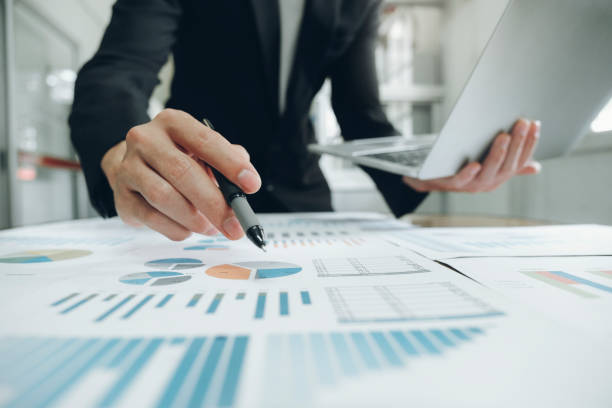 Businessman analyse investment marketing data. Businessman planning and analyse investment marketing data. planned economy stock pictures, royalty-free photos & images