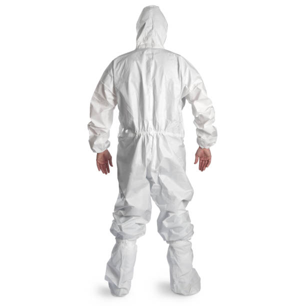 istock Man in white isolation suit on white background 1327129129