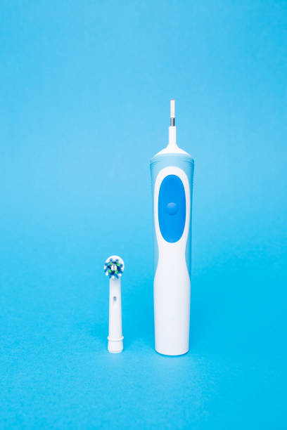 istock Smart electric toothbrush on a blue isolated background 1327132489
