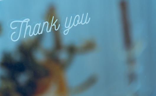 Words thank you on window glass with copy space. Thank you concept.