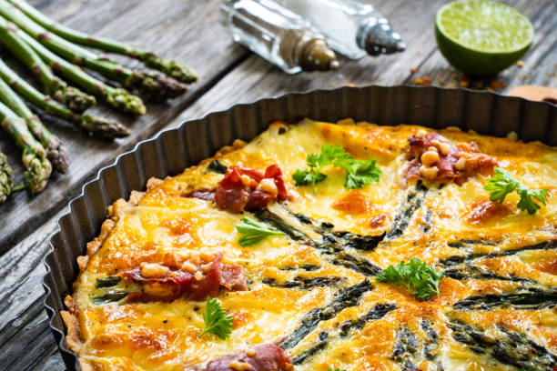 istock Tart with asparagus and serrano ham on wooden table 1327138313