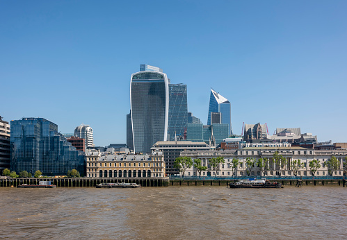 Looking across the River Thames towards the City of London from the South Bank on a sunny spring day. Behind the Old Billingsgate Market building are ‘The Walkie-Talkie’ (20 Fenchurch Street), ‘The Cheesegrater’ (Leadenhall House, 122 Leadenhall Street) and ‘The Scalpel’ (52 Lime Street), so nicknamed because of their shapes.