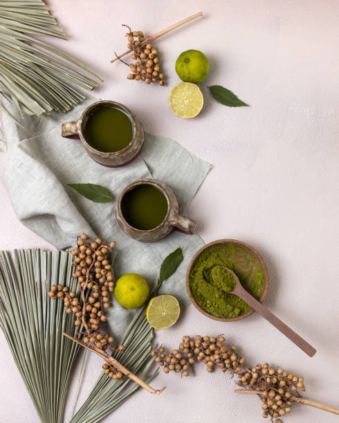 istock Matcha Green Tea in Ceramic Cups with Green Leaves on Top View 1327141591