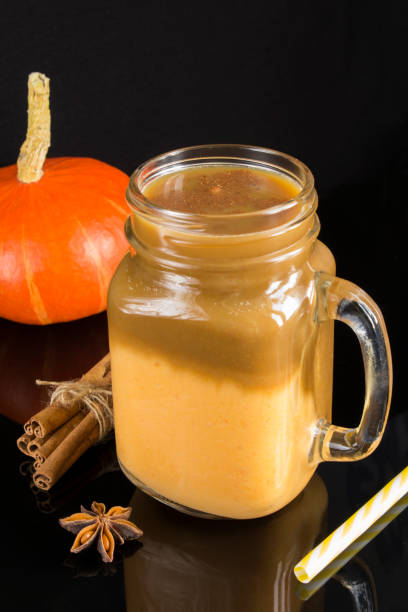 istock Pumpkin latte in the drinking glass on the dark background 1327142629