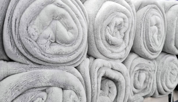 istock Rolled gray blankets  in a store for sale 1327142733
