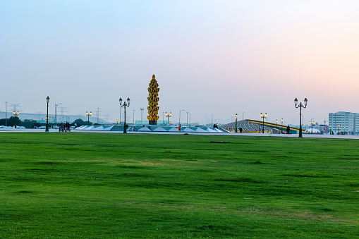 Sharjah, United Arab Emirates - June 19, 2021: University garden or park in the evening.