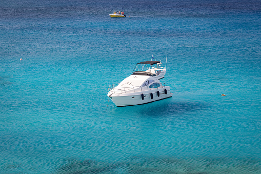 Protaras, Cyprus - June 25, 2021: Yacht in the blue lagoon