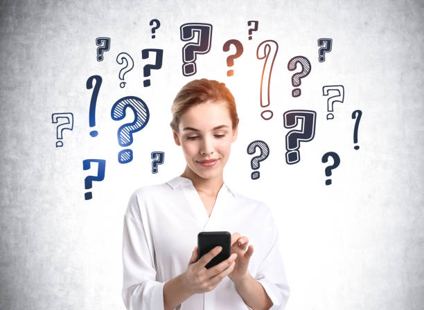 istock Businesswoman with phone in hands, question marks sketch 1327147579