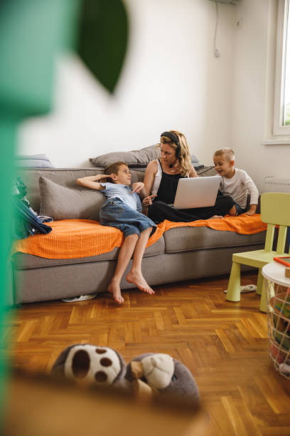 istock Mother trying to work while her two boys are being mischievous 1327147852
