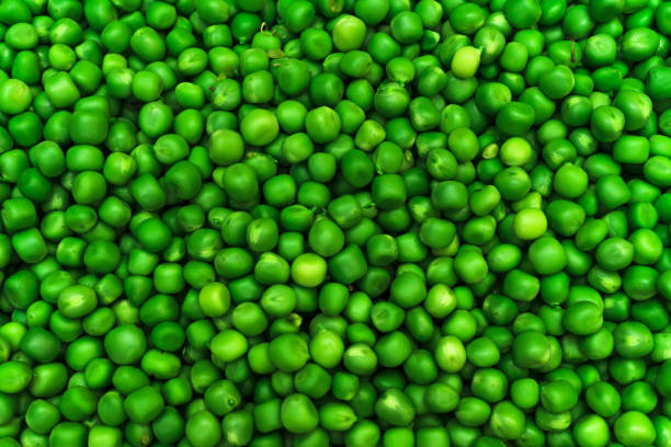 istock Green Pea Seeds, Peeled Peas, Green Pea Seed Background 1327150490