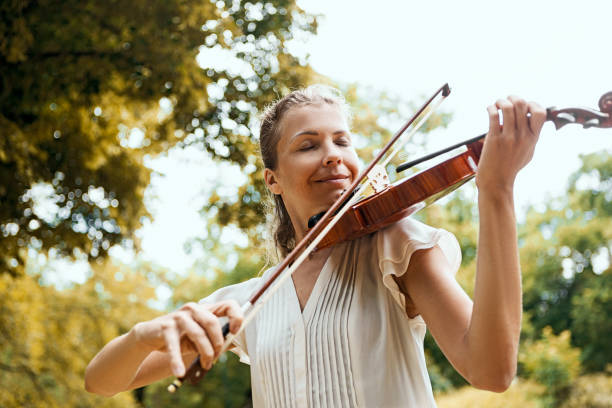 Free Stock Photo of Young woman playing violin in nature | Download ...
