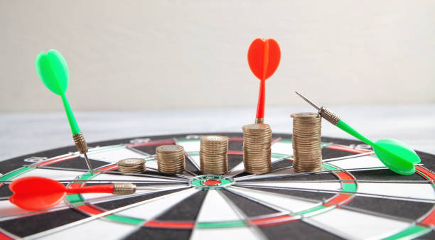 istock Coins and target dartboard. Business strategy. Achievement. Goals 1327152130