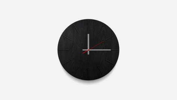 istock Stylish black round clock on a white wall. Time on the wall as an element of the interior. Simple modern round clock on white wall 1327153228