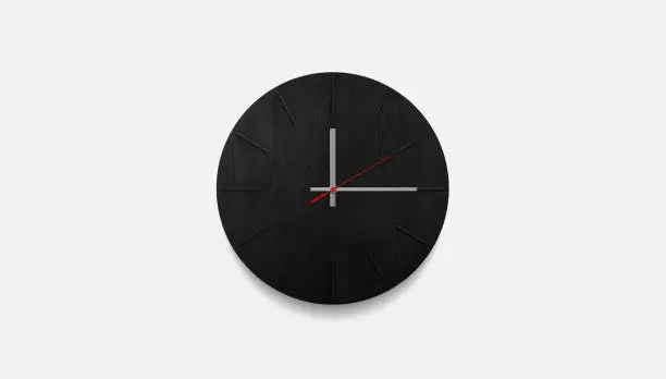 Photo of Stylish black round clock on a white wall. Time on the wall as an element of the interior. Simple modern round clock on white wall