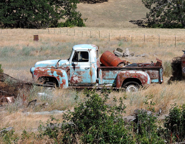 istock Abandoned Truck In A Field 1327154786