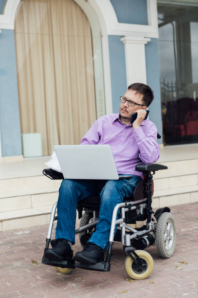 istock man disabled with wheelchair work business online 1327157113