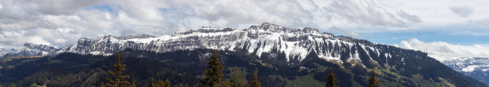 Panoramic view of sigriswil mountain ridge covered in snow.