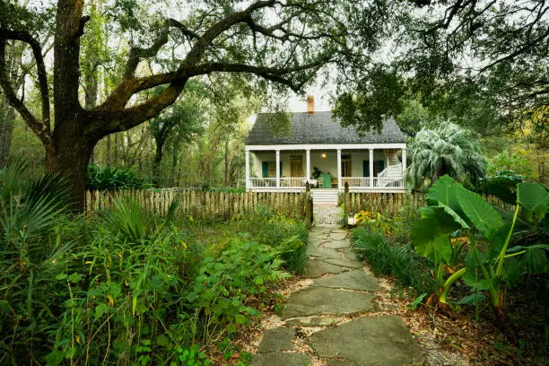 Entrance to Maison Madeleine B&B, authentic 1840 French Creole cottage restored by Madeline Cenec, with two guestrooms available for tourists. Located on the edge of Lake Martin cypress swamp, Breaux Bridge, Louisiana, USA