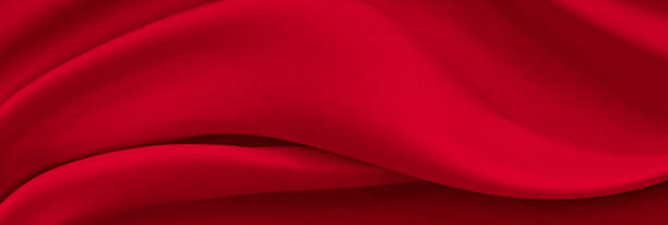 istock Black red satin dark fabric texture luxurious shiny that is abstract silk cloth background with patterns soft waves blur beautiful. 1327171403