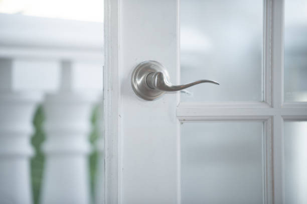 istock White vintage door wedding arch with silver handles on white column balcony 1327178434