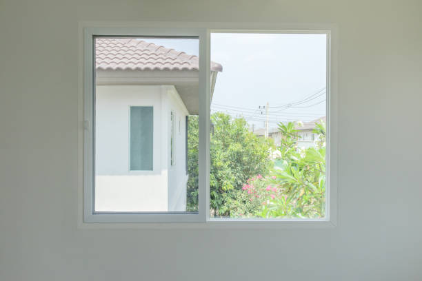 istock Glass window frame house interior on white wall 1327180096