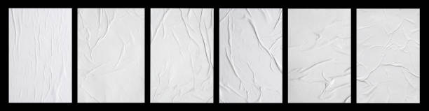white crumpled and creased glued paper poster set isolated on black background - crease imagens e fotografias de stock