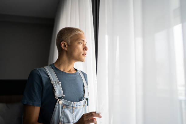 istock Young man contemplating at home 1327181745