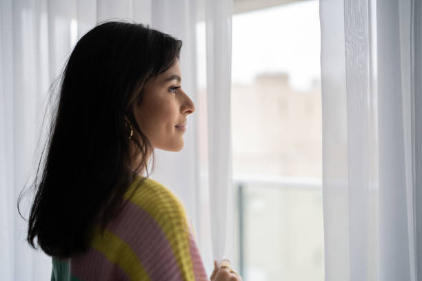 istock Young woman contemplating at home 1327182078