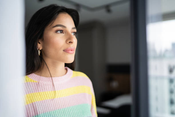 istock Young woman contemplating at home 1327182115