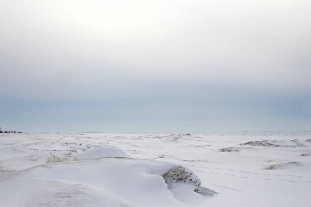 istock Frozen lake covered by snow like white desert 1327192792