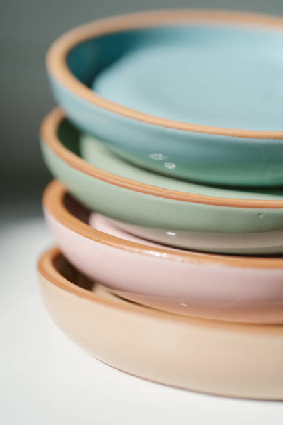 istock A large stack of ceramic cups in pastel colors. 1327197731