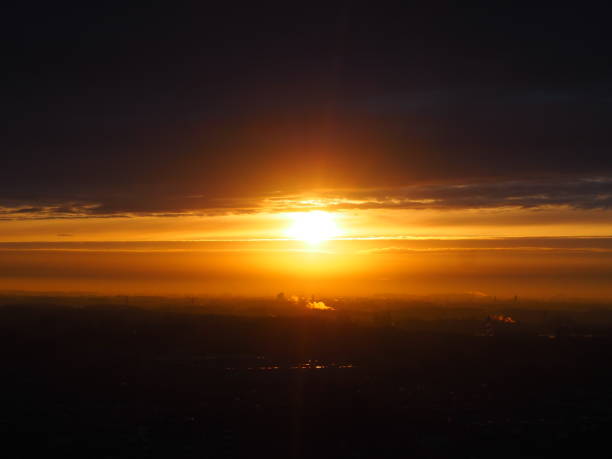 istock Yellow and black in the morning sky 1327198291