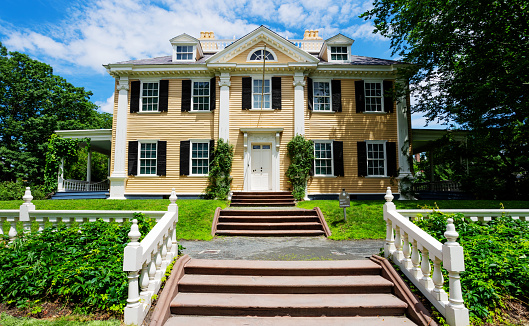 Cambridge, Massachusetts, USA - July 5, 2021: The Longfellow House (c. 1759) on Brattle Street in Cambridge. It was George Washington's headquarters between July 1775 and April 1776 during the American Revolution. The American poet Henry Wadsworth Longfellow became its owner in 1843. It is now administered by the National Park Service.