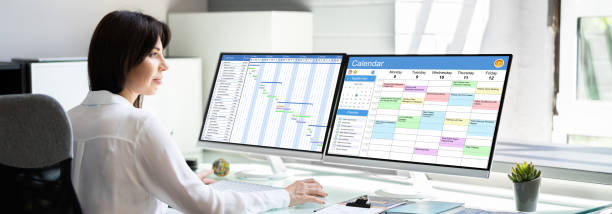 istock Woman Looking At Calendar Screen 1327202437