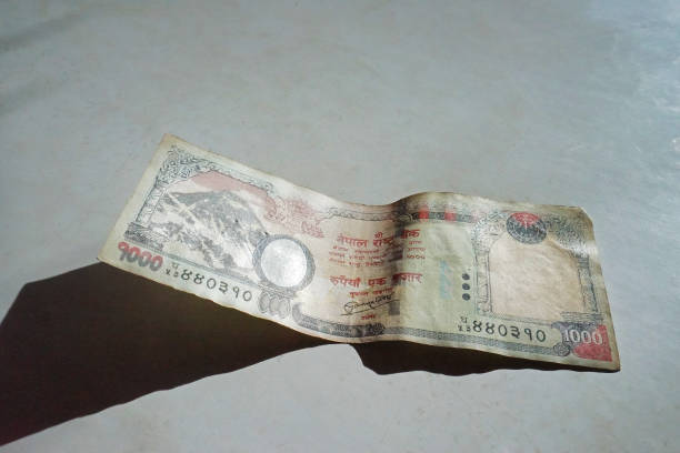 istock Close up Nepali Rupee banknotes on white table 1327203261